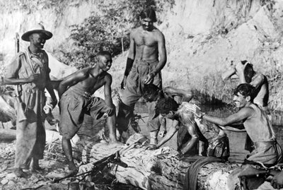 West African and Indian troops bathing in a stream, 1944-45 by English Photographer